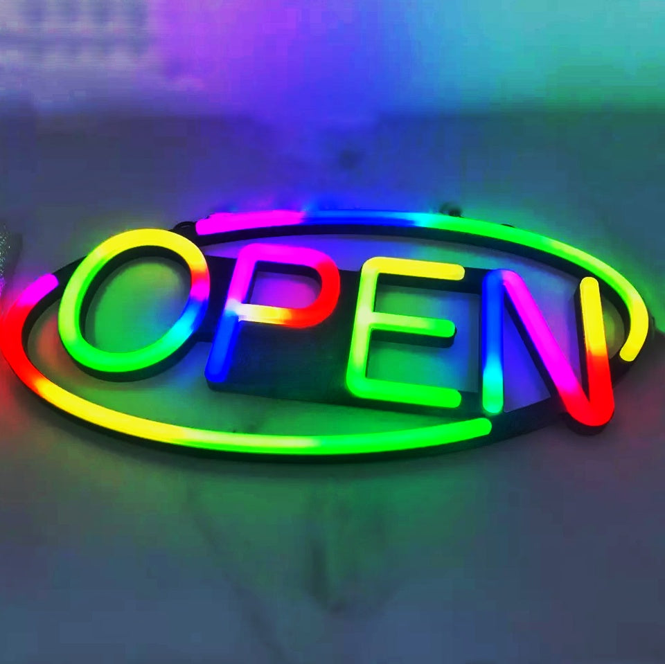 Multi coloured rainbow open sign